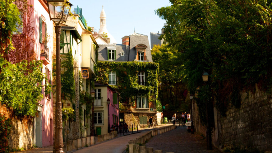 Empty street with coloured houses in Mormartre, Paris