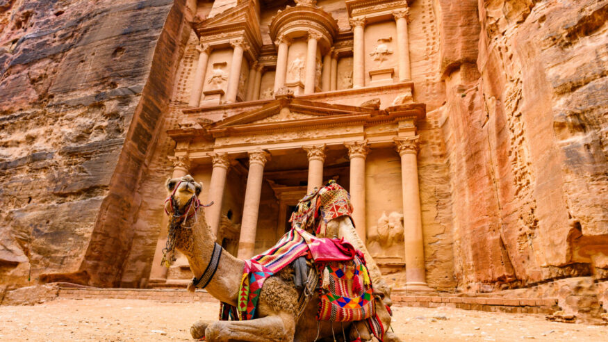Spectacular view of two beautiful camels in front of Al Khazneh (The Treasury) in Petra. Petra is a historical and archaeological city in southern Jordan.