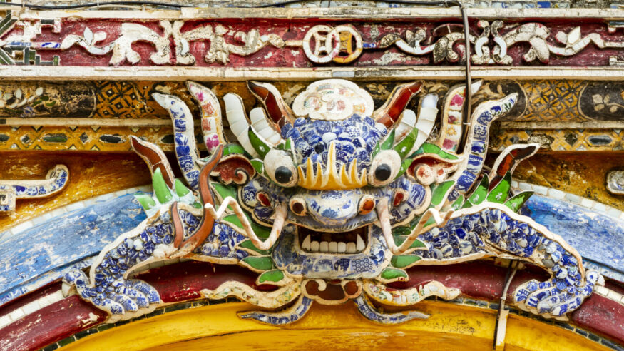 Detail Of Ceramic Mosaic Dragon Of A Palace In Hue Imperial Citadel. Hue Imperial Citadel, A UNESCO Cultural Heritage Is A Major Tourist Destination In Vietnam.