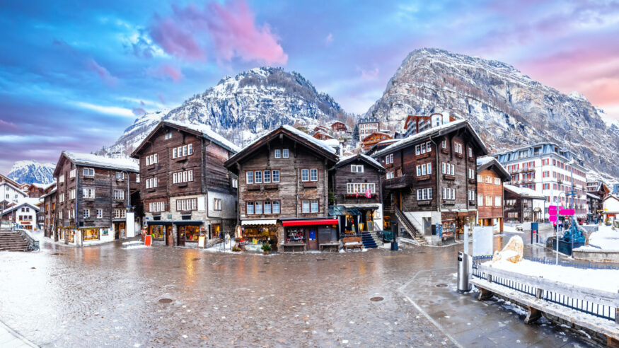 Idyllic mountain village of Zermatt square panoramic view, luxury Alpine winter destination in Switzerland